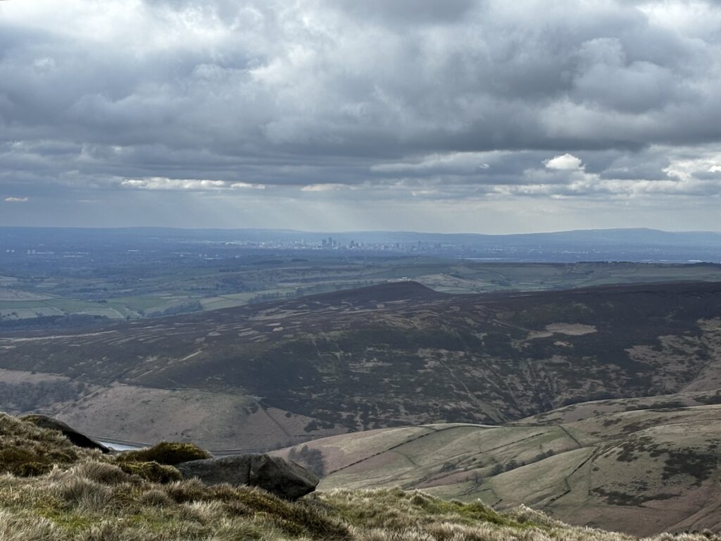view of the Manchester skyline from the Peak District